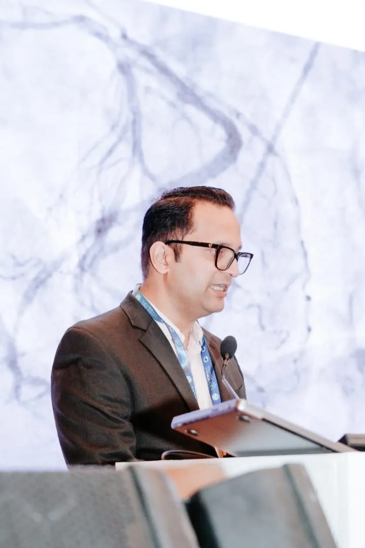 Dr. Shailesh Singh at conference podium