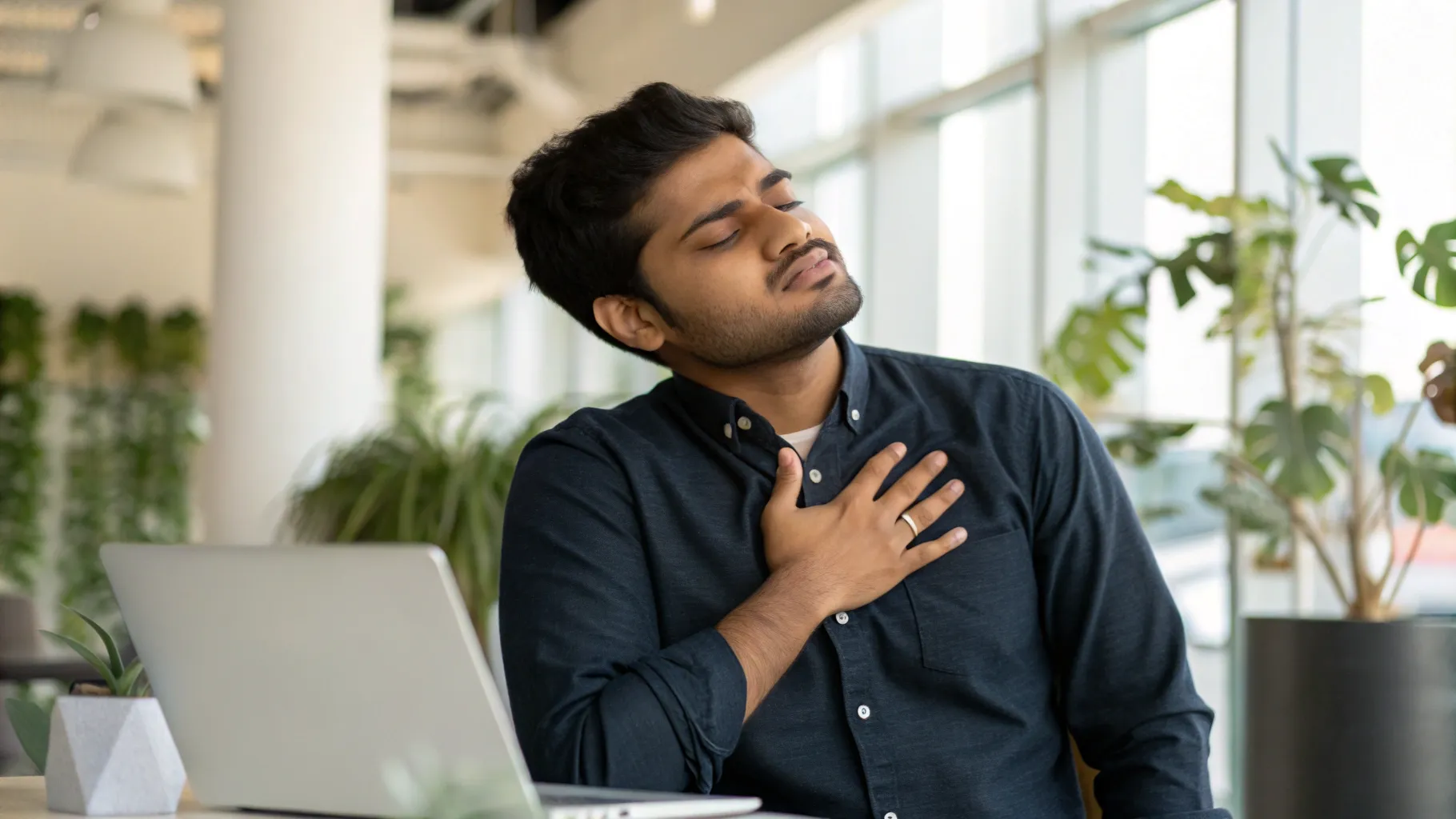 Man noticing his heartbeat at work