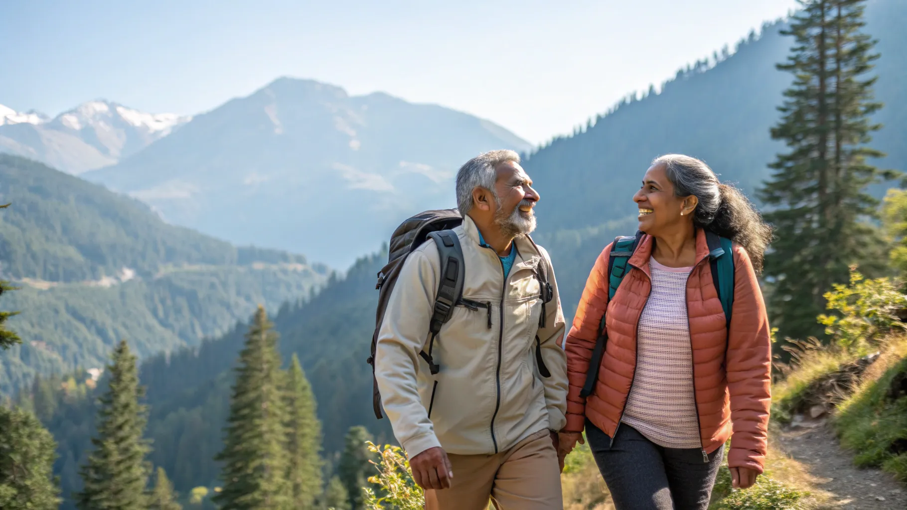 Couple hiking together in mountains - active life after heart treatment