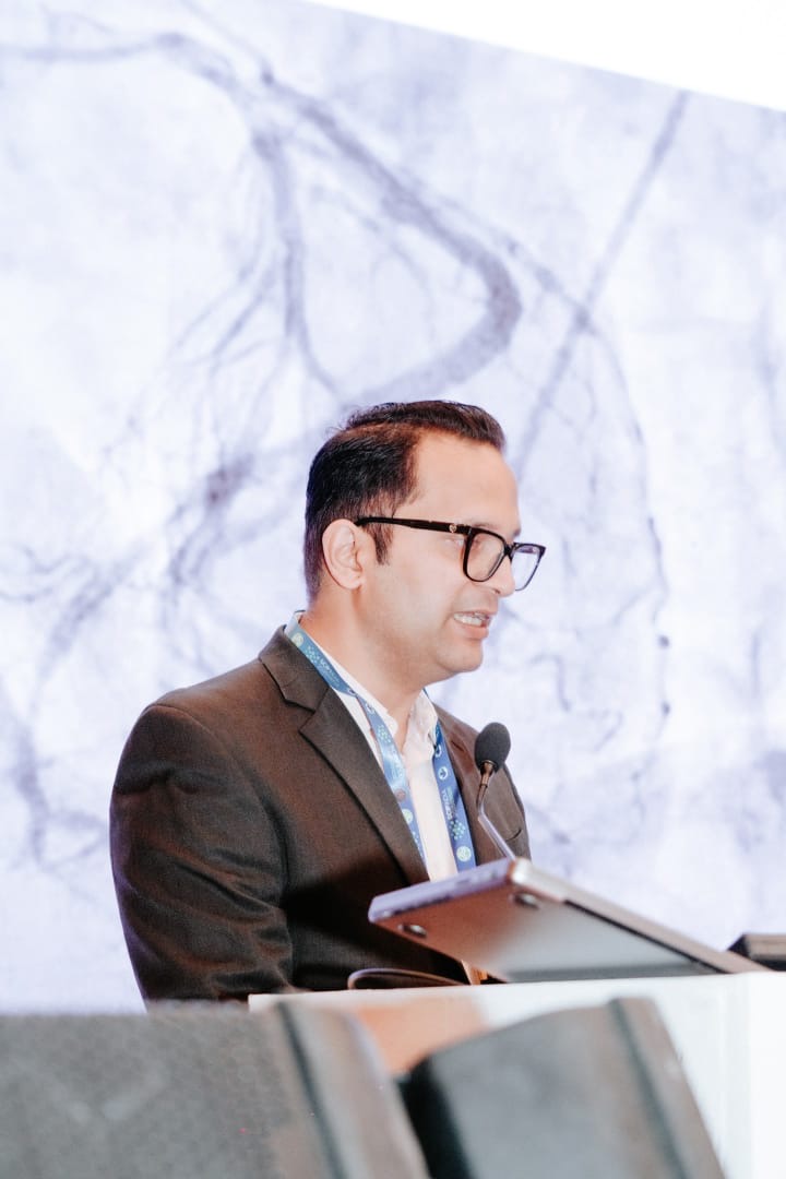 Dr. Shailesh Singh at conference podium