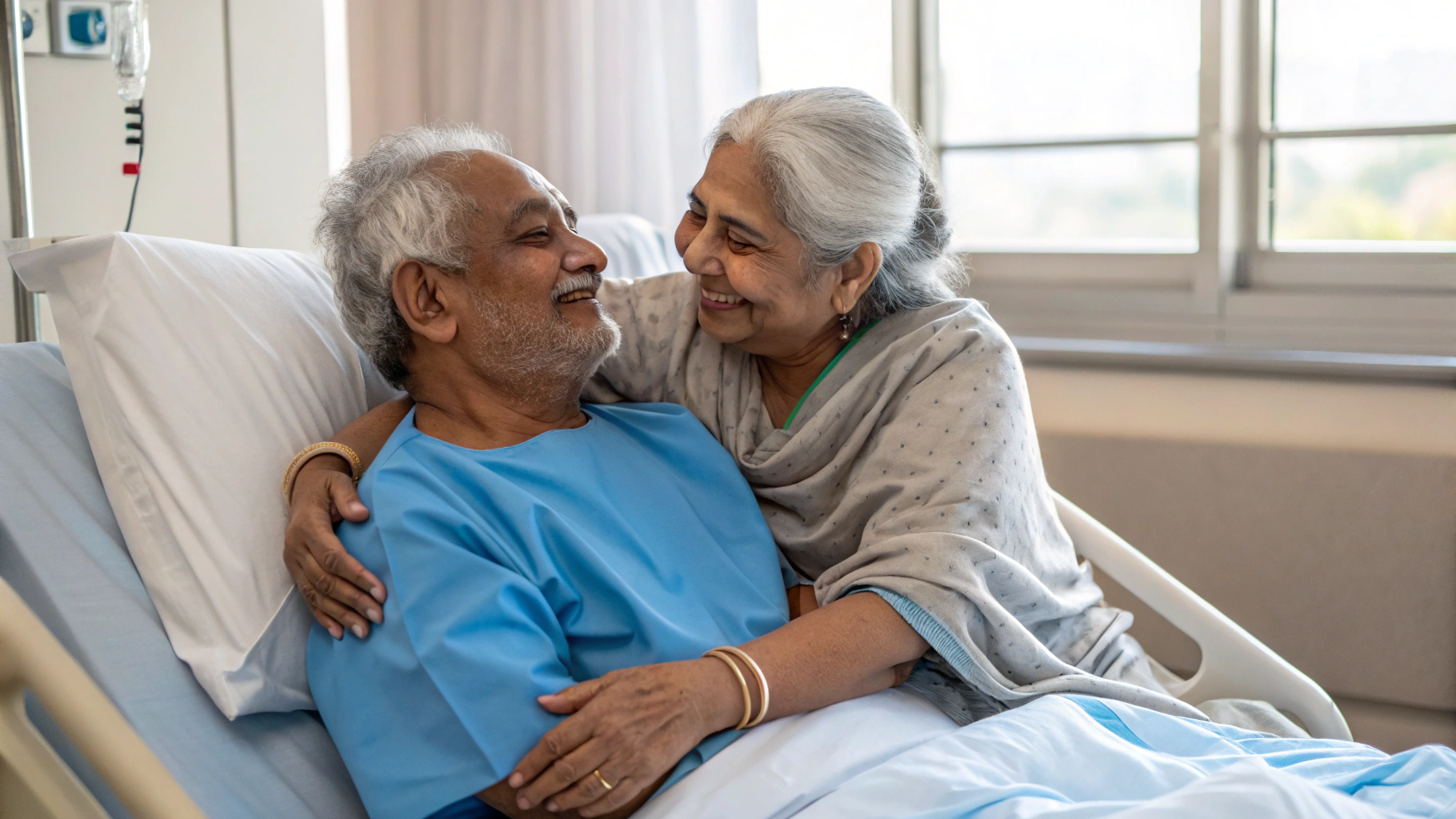 Elderly couple embracing after successful procedure