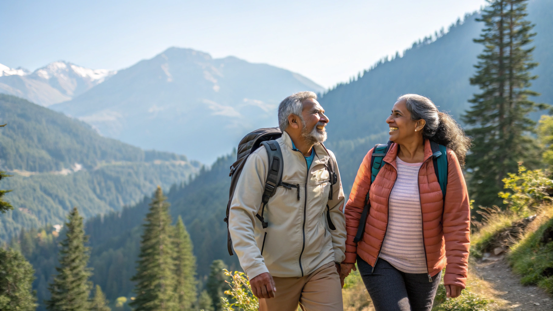Couple hiking together in mountains - active life after heart treatment